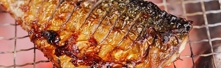 Grilled fish over hot charcoal