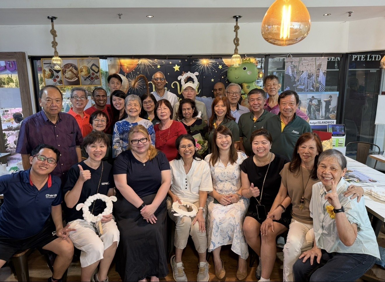 CharB with happy guests at a group dining gathering