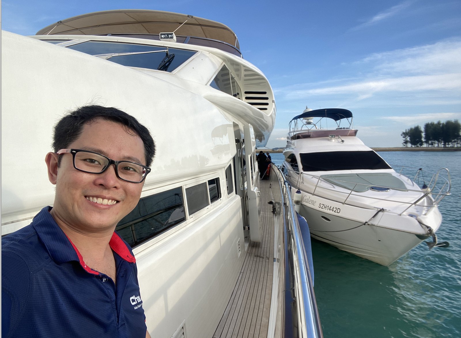 CharB owner on a yacht at a Singapore marina before a yacht dining event